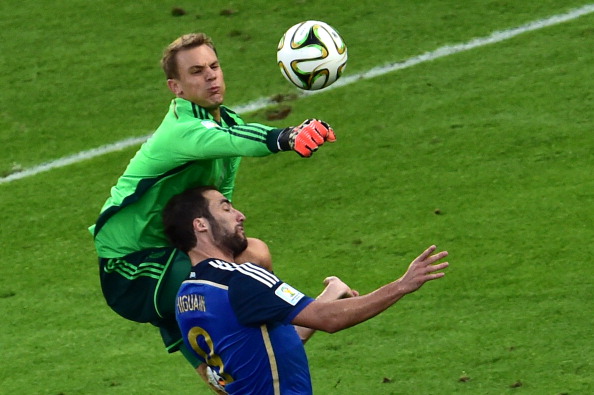 Germany's goalkeeper Manuel Neuer (L) and Argentina's forward Gonzalo Higuain compete for the ball during the final football match between Germany and Argentina for the FIFA World Cup at The Maracana Stadium in Rio de Janeiro on July 13, 2014. AFP PHOTO / NELSON ALMEIDA (Photo credit should read NELSON ALMEIDA/AFP/Getty Images)